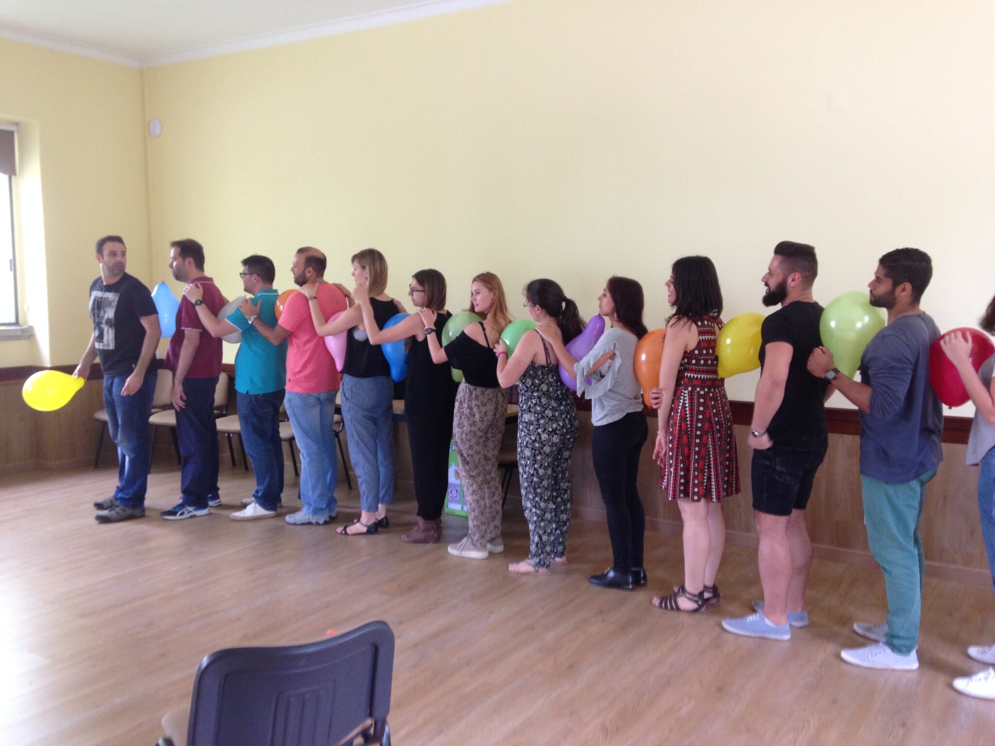 Group of participants during a collective coaching workshop, teamwork and group dynamics